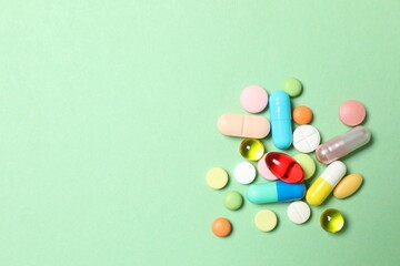 Various pills on color background