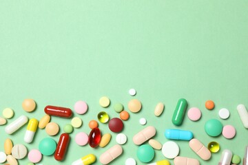 Various pills on color background