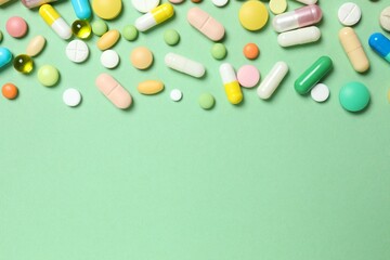Various pills on color background