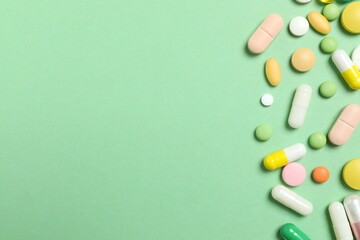 Various pills on color background