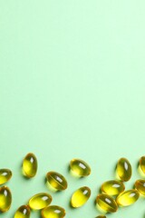 Capsule of omega 3, 6, 9 fish oil, vitamin, food supplement on color background