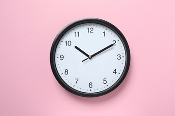 Big beautiful stylish clock on color background