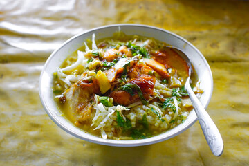 Soto ayam is a typical Indonesian dish in the form of chicken soup with yellowish sauce. This yellow color is due to turmeric which is used as a spice, indonesian food. 