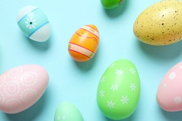 Happy Easter card. Easter eggs on color background, top view