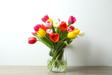 Beautiful fresh tulips in a vase on the table