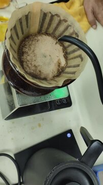 Close up the process of pouring water to drip coffee.
