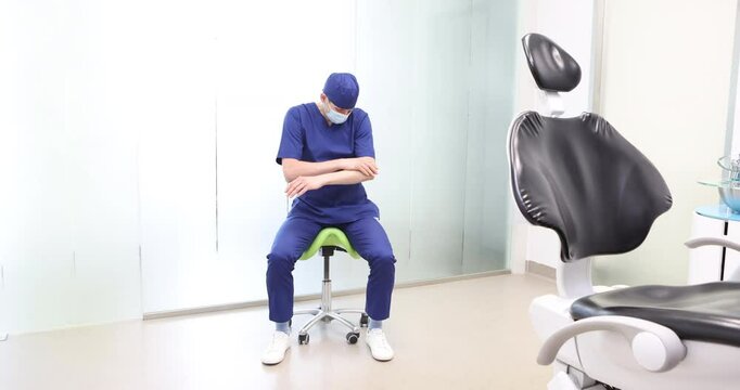 Sitting dentist, dealing with forearm muscle pain.Symptoms and self help exercises, stretching. front view