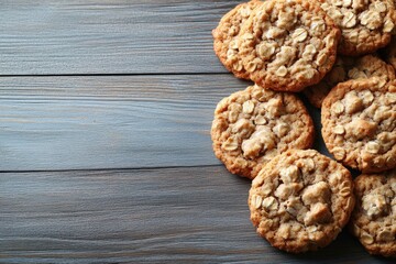 Fototapeta premium Golden brown cookies arranged on rustic wooden surface create wa