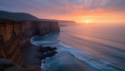 Naklejka premium Scenic coastal cliffs and ocean at sunset with vivid skies