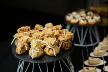 An Elegant Assortment of Gourmet Desserts and Savory Snacks Beautifully Arranged on Table