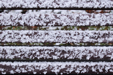 snow on wooden planks close-up

