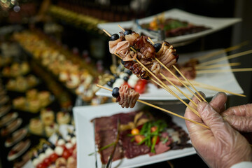 Indulge in Gourmet Skewers featuring a Diverse Selection of Delectable Delicacies at a Buffet