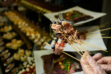 Indulge in Gourmet Skewers featuring a Diverse Selection of Delectable Delicacies at a Buffet