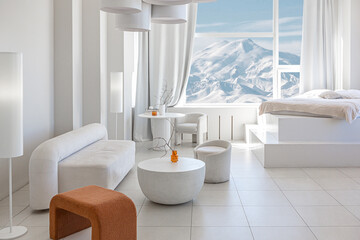 modern pure white interior design of a spacious room features a cozy bed and stylish furniture. Large windows frame a stunning snowy mountain landscape, creating a serene atmosphere during daylight.