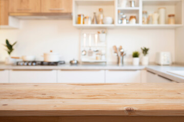 Brown wooden table for product montage on blur kitchen counter interior background