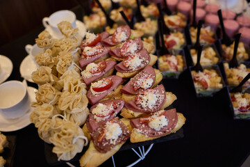 An Elegant Assortment of Gourmet Desserts and Savory Snacks Beautifully Arranged on Table