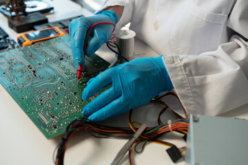 Close up of Technician measuring voltage electronic circuit board, Service after sale fix electric equipment.