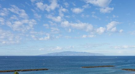 View of La Gomera from Costa Adeje, Playa de Fañabe, Tenerife.