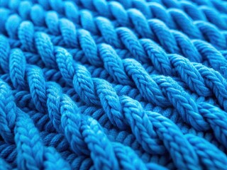 Soft blue wool knit texture, perfect for cozy winter backgrounds.  Handmade craft, textured surface detail.