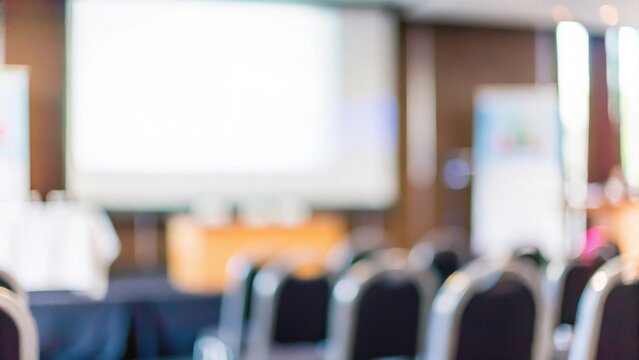 Seminar Room Blur &ndash; A blurred auditorium or seminar setup with a projector.	

