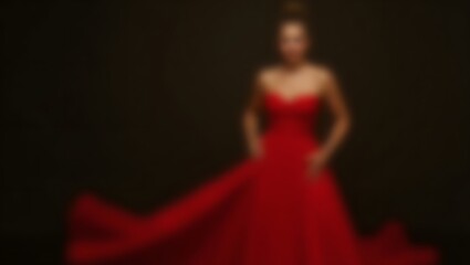 Fototapeta premium Blurred image of a woman in red