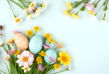 Colorful eggs with flowers on a pink background Easter card with space for text