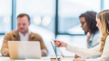 Team Collaboration Blur – A group of professionals collaborating in a conference room, with the background blurred.	
