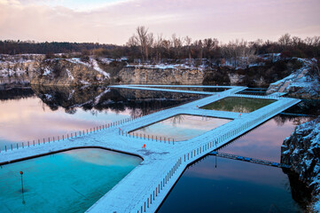 Winter Quarry with Snow-Covered Walkway and Pools. Zakrzówek, Krakow 
