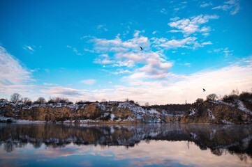 Serene Lake with Cliffs and Birds