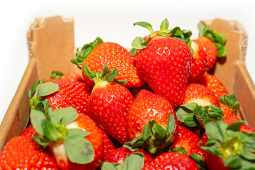 Cardboard box with large ripe strawberries