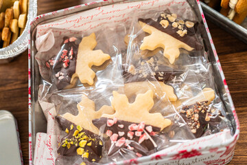 Festive Christmas Tin Boxes Filled with Chocolate-Dipped Treats