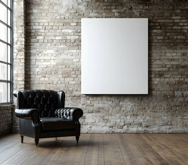 A photograph of a large, white, blank canvas on the wall in an empty room with an old black leather Chesterfield chair,