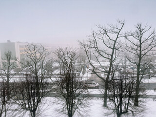 Winter urban landscape in a small city, snowy day, ugly city in winter