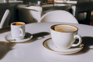 Cappuccino in a ceramic mug in an elegant cafe, coffee taste, caffeine, lunch, brunch, caffe art
