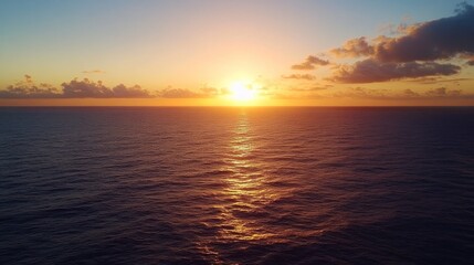 Obraz premium Serene Sunset over the Ocean: A Breathtaking Aerial View