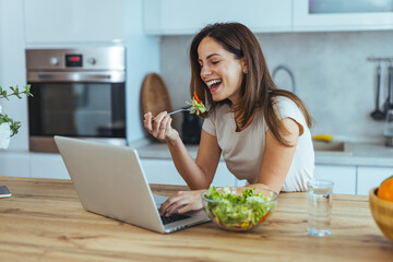 Woman Enjoying Healthy Salad While Video Chatting in Modern Kitchen