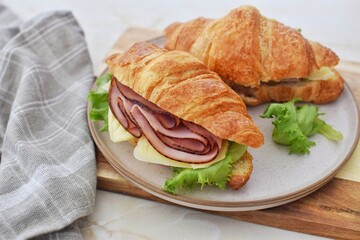 Croissants sandwich with ham and cheese.