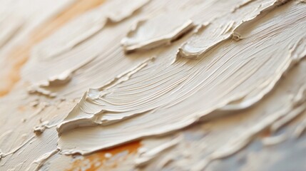 Fototapeta premium Close-up of textured brushstrokes in cream and beige abstract painting