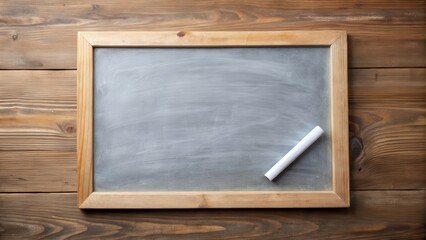 A piece of chalk lies on a wooden table next to an empty white slate board with a few faint marks remaining , workspace