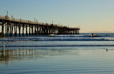 Old fashioned trestle pier at sunset