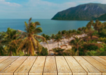 Wooden table top on the beach or sea.Party on the beach  sunshine time concept.For montage product display or design key visual layout.View of copy space.