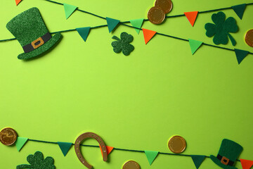 St Patricks Day background with green leprechaun hats, shamrocks, gold coins, a horseshoe, and...