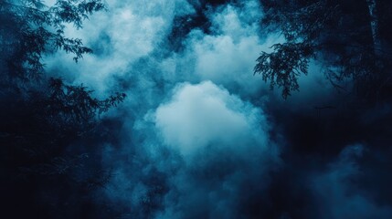 Obraz premium Dense dark blue smoke swirling through a forest landscape illustrating the dangers and destruction of wildfires with ample empty space for text and impact.
