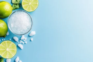 Minimalist cocktail setup featuring margarita glass lime and salt on pastel blue background © Евгения Рубцова