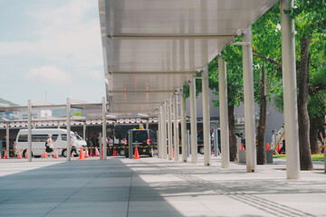 a Calming view of pedestrians street with canopy and pillars. It make shady and cool vibes during...