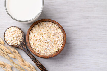 Oat flakes in bowl and oat milk on white background, Alternative milk made from plant, non dairy