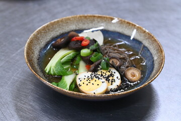 The Asian cuisine reflects a traditional Vietnamese dish, offering a harmonious blend of authentic flavors. Pho BO soup.