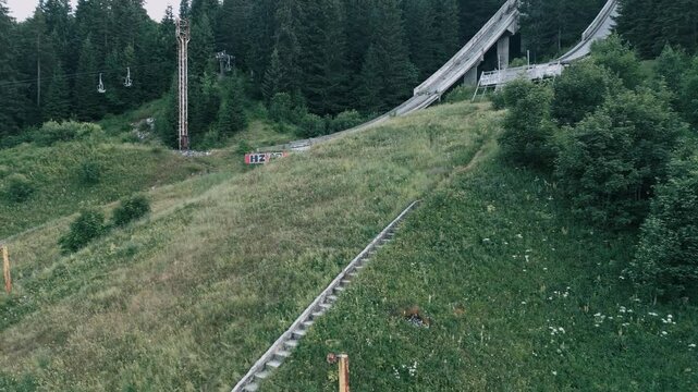 Igman Ski Jump &ndash; Aerial View of Historic Olympic Venue - Stunning aerial footage of the Igman ski jump, a historic Olympic venue surrounded by breathtaking mountain scenery. The video showcases the ic