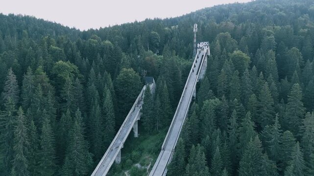 Igman Ski Jump &ndash; Aerial View of Historic Olympic Venue - Stunning aerial footage of the Igman ski jump, a historic Olympic venue surrounded by breathtaking mountain scenery. The video showcases the ic
