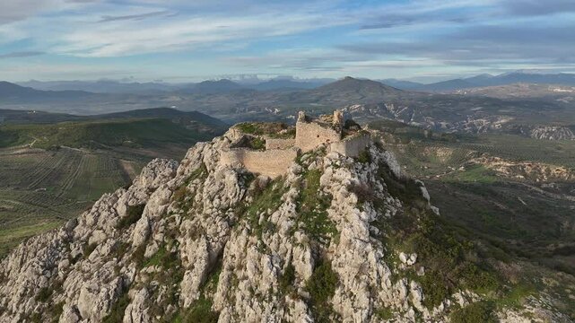 A stunning aerial drone view of the Castle of Penteskoufi near Corinth, Greece, captured on a clear morning. 